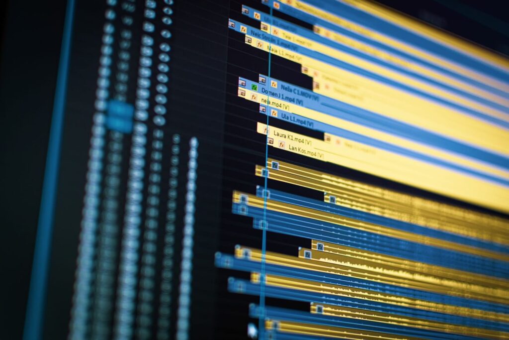 Close up of a colorful multitrack video editing timeline on a computer screen